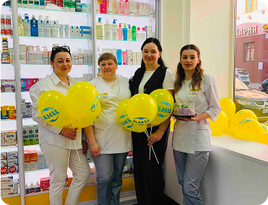 ANC pharmacy team with balloons inside store