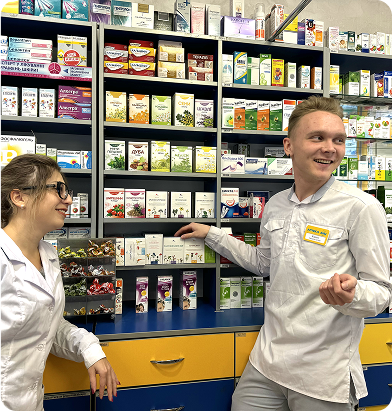 Two smiling ANC team members among product shelves